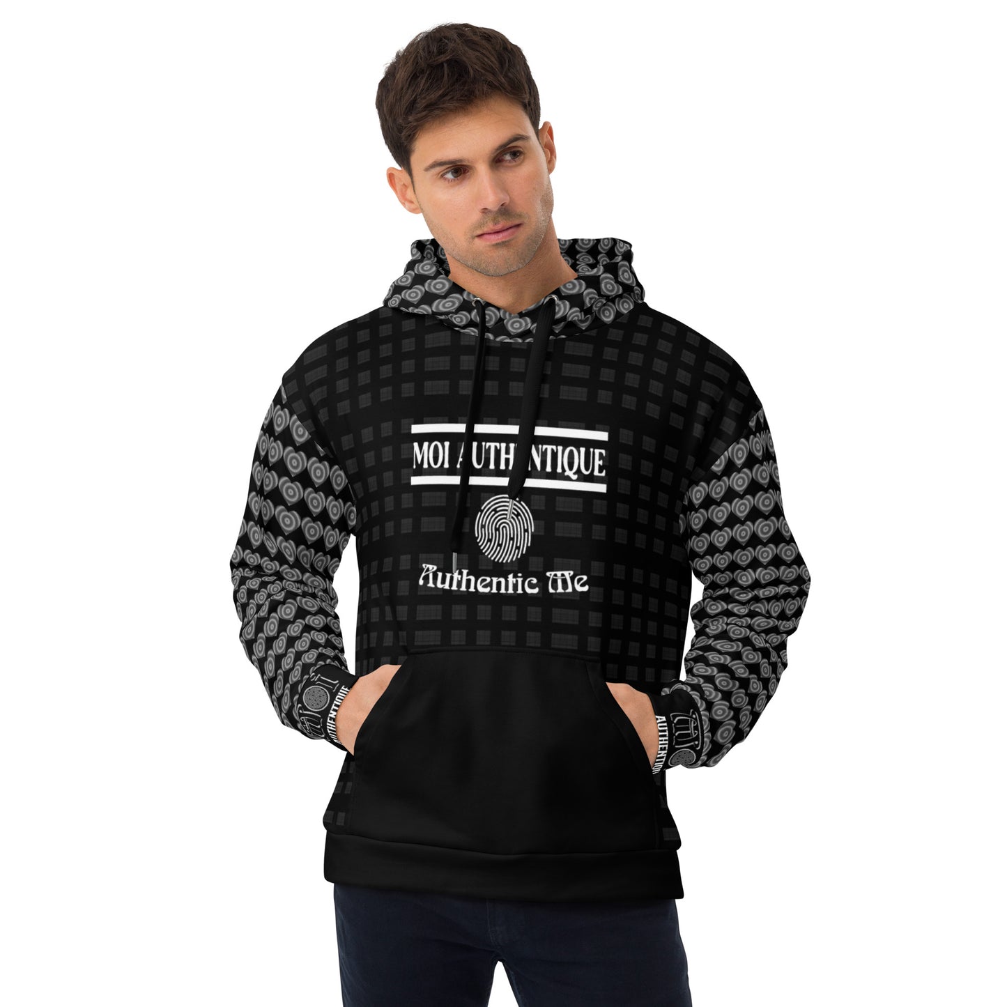 Man wearing a black and gray patterned hoodie with text on a white background