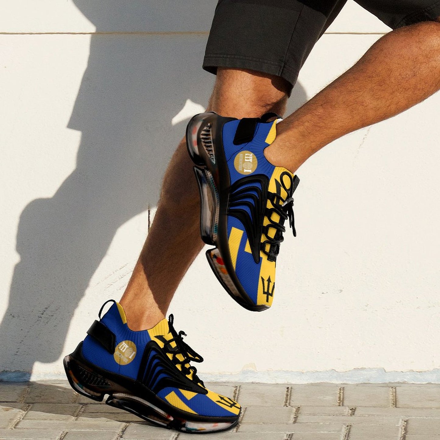 Blue and yellow sneakers worn by a person on a light background