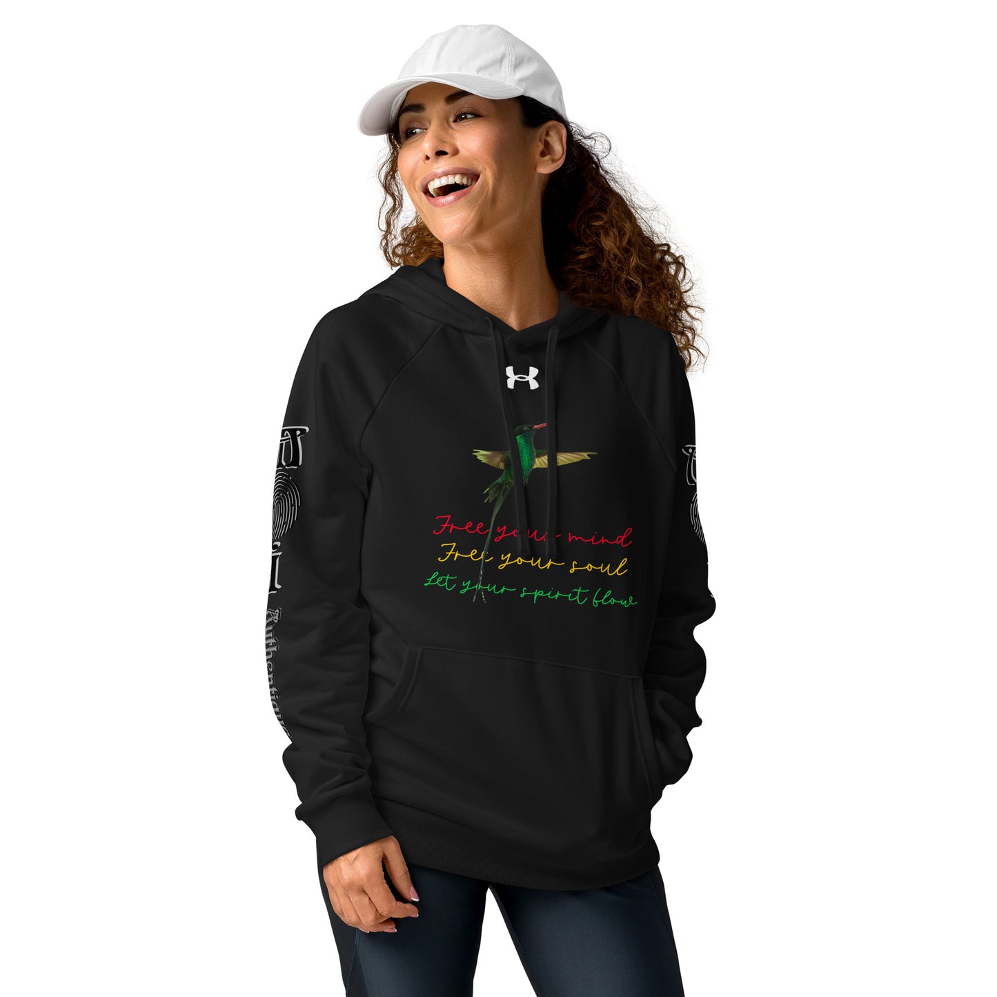 A woman wearing a black Under Armour hoodie with multicoloured text and graphics, a front pouch pocket, and ribbed cuffs.