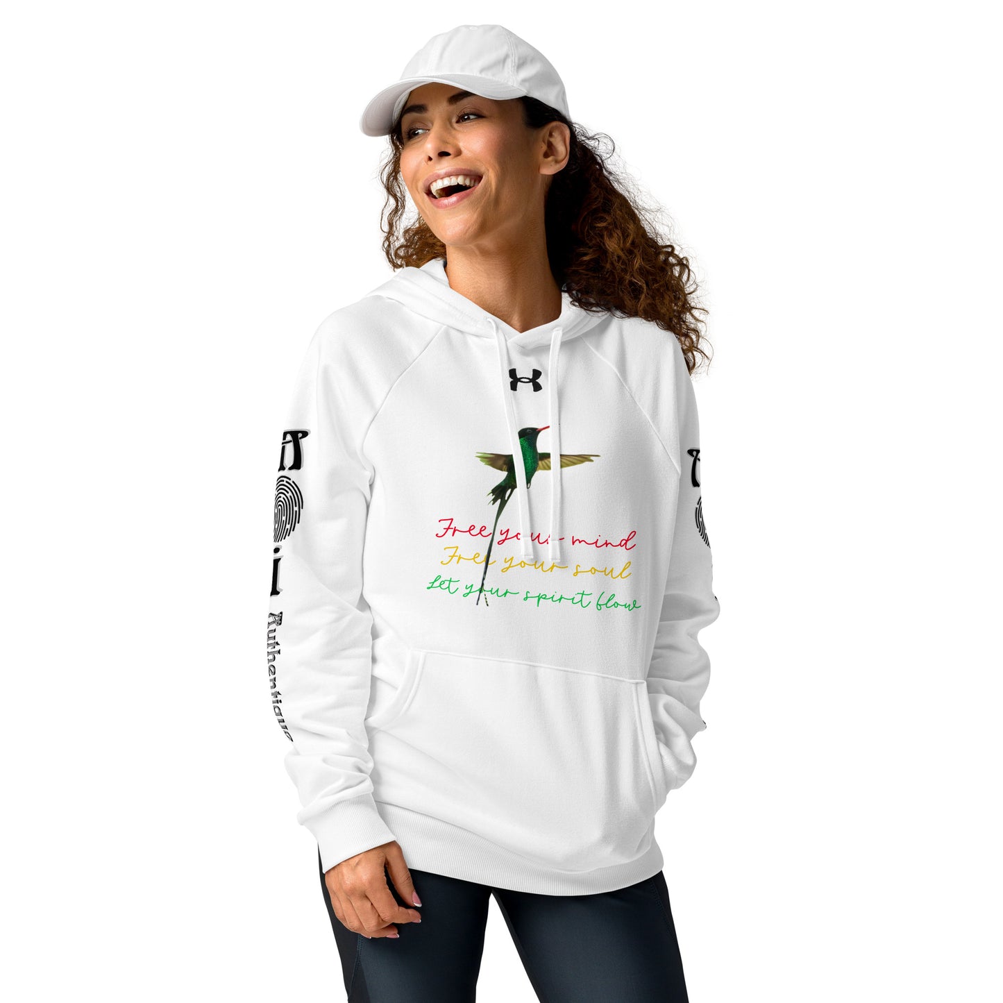 A woman wearing a white Under Armour hoodie with multicoloured text and graphics, a front pouch pocket, and ribbed cuffs.