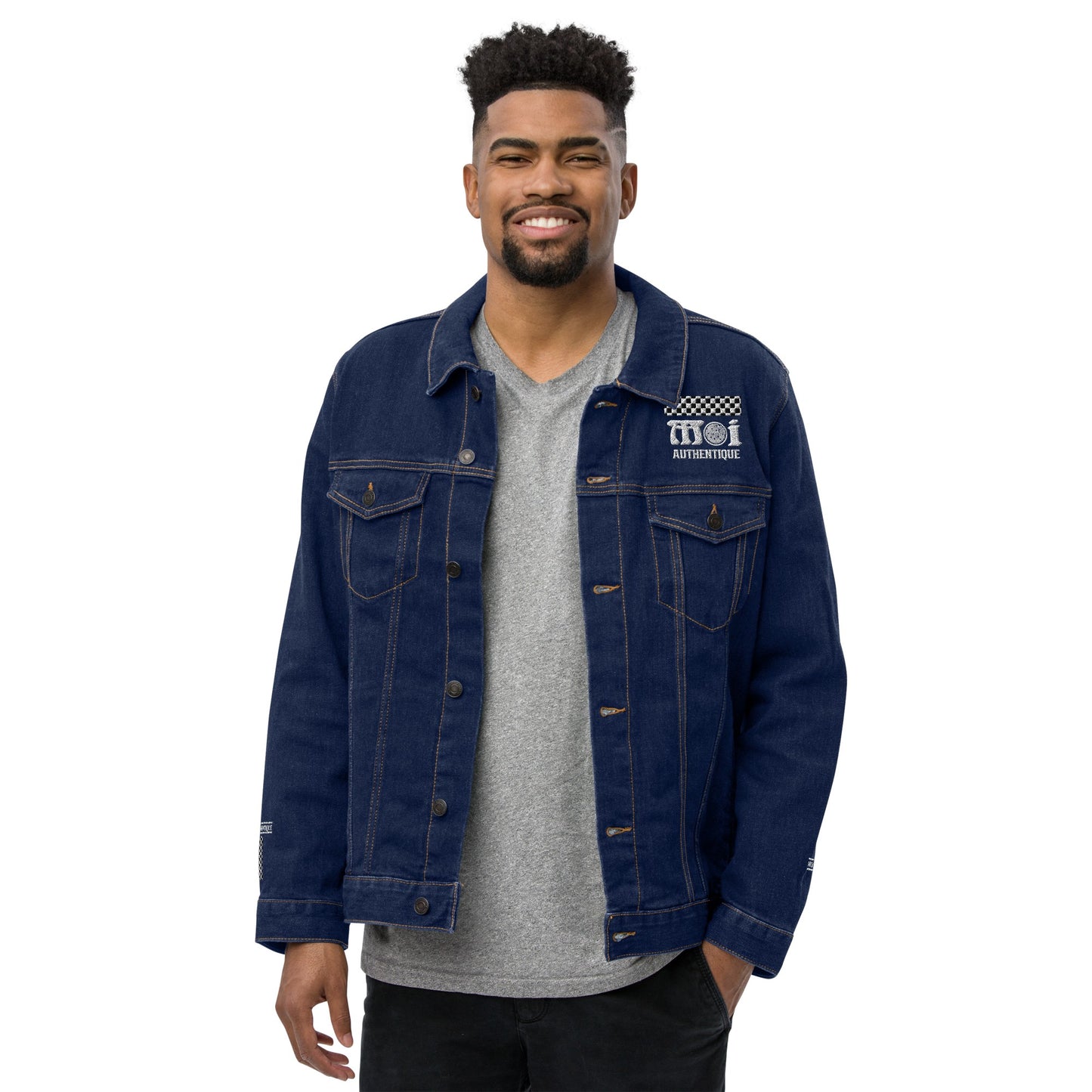 Man wearing a blue denim jacket with a brand logo on a white background
